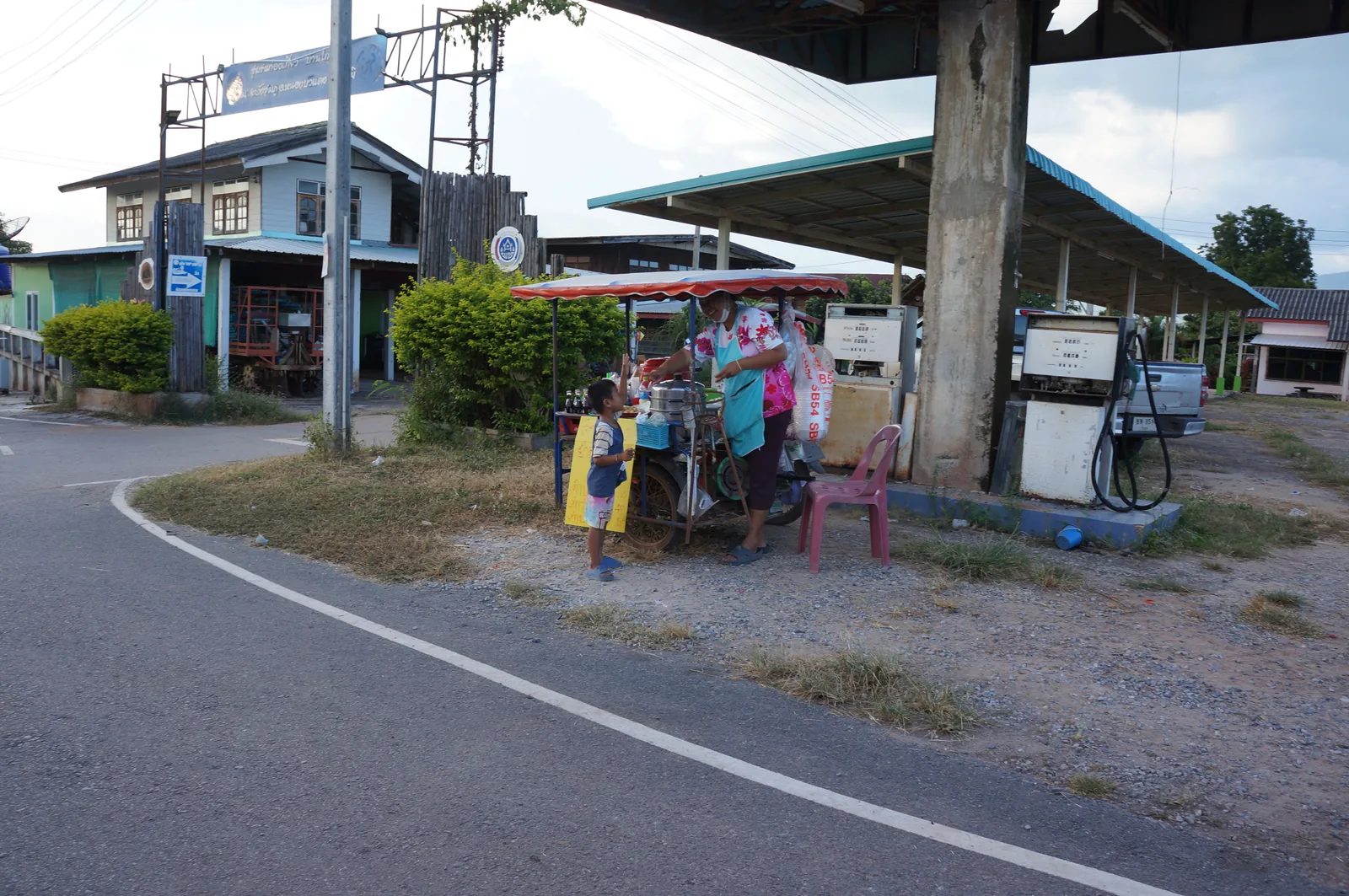 The petrol station where the road bends