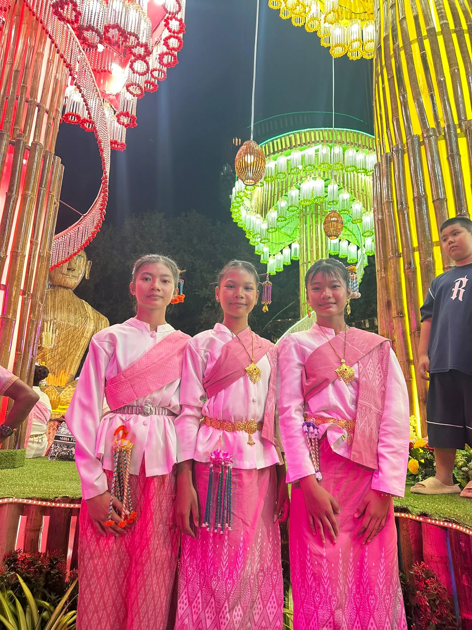 Three dancers in festival dress