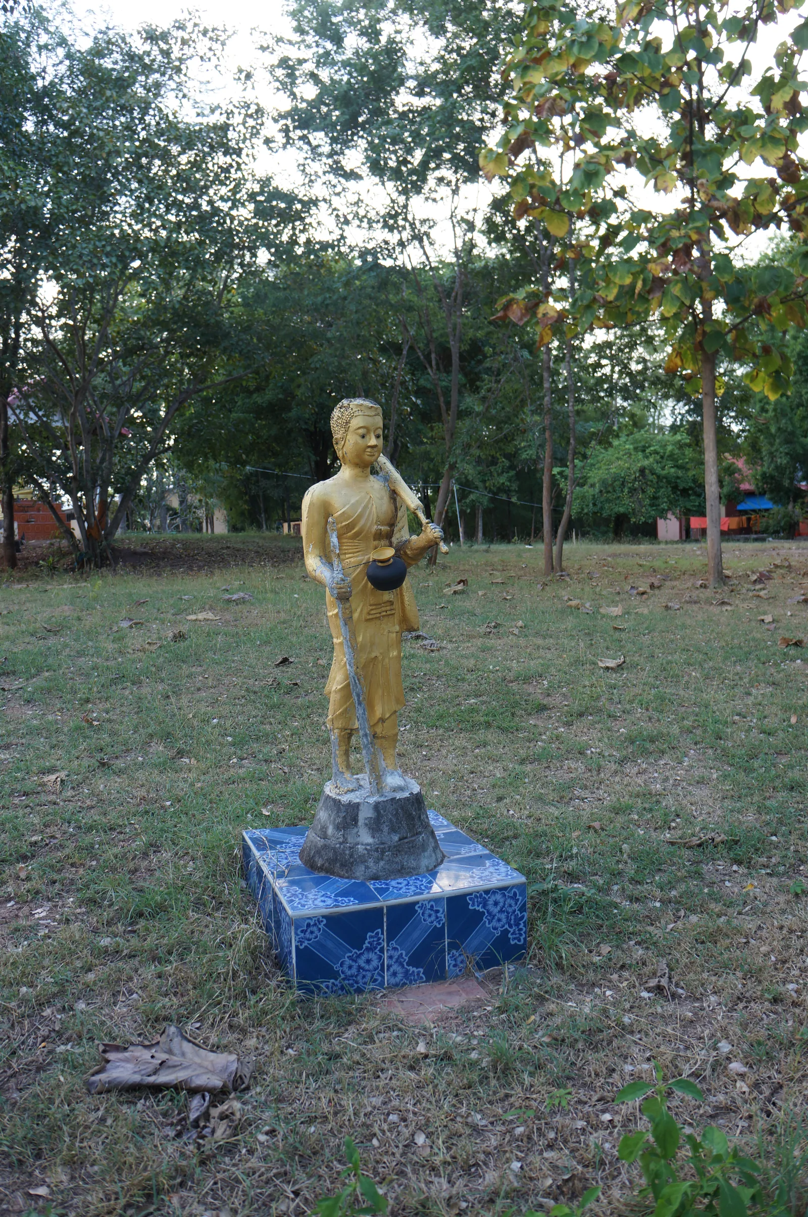 A standing Buddha in the temple grounds